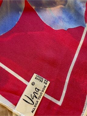 Lovely Vera silk scarf in vibrant, sky, blues, & sunset pinks. Approx 52 x 11.